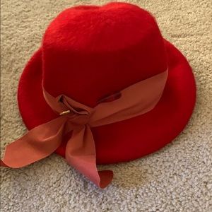Red vintage hat with hat pin.